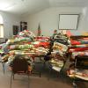 Quilts being boxed up for shipment to Lutheran World Relief. JoAnn Meyer - LWML President in background.